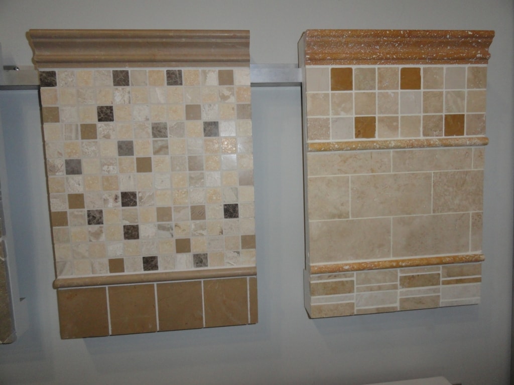 Travertine mosaic and tile sample boards in showroom